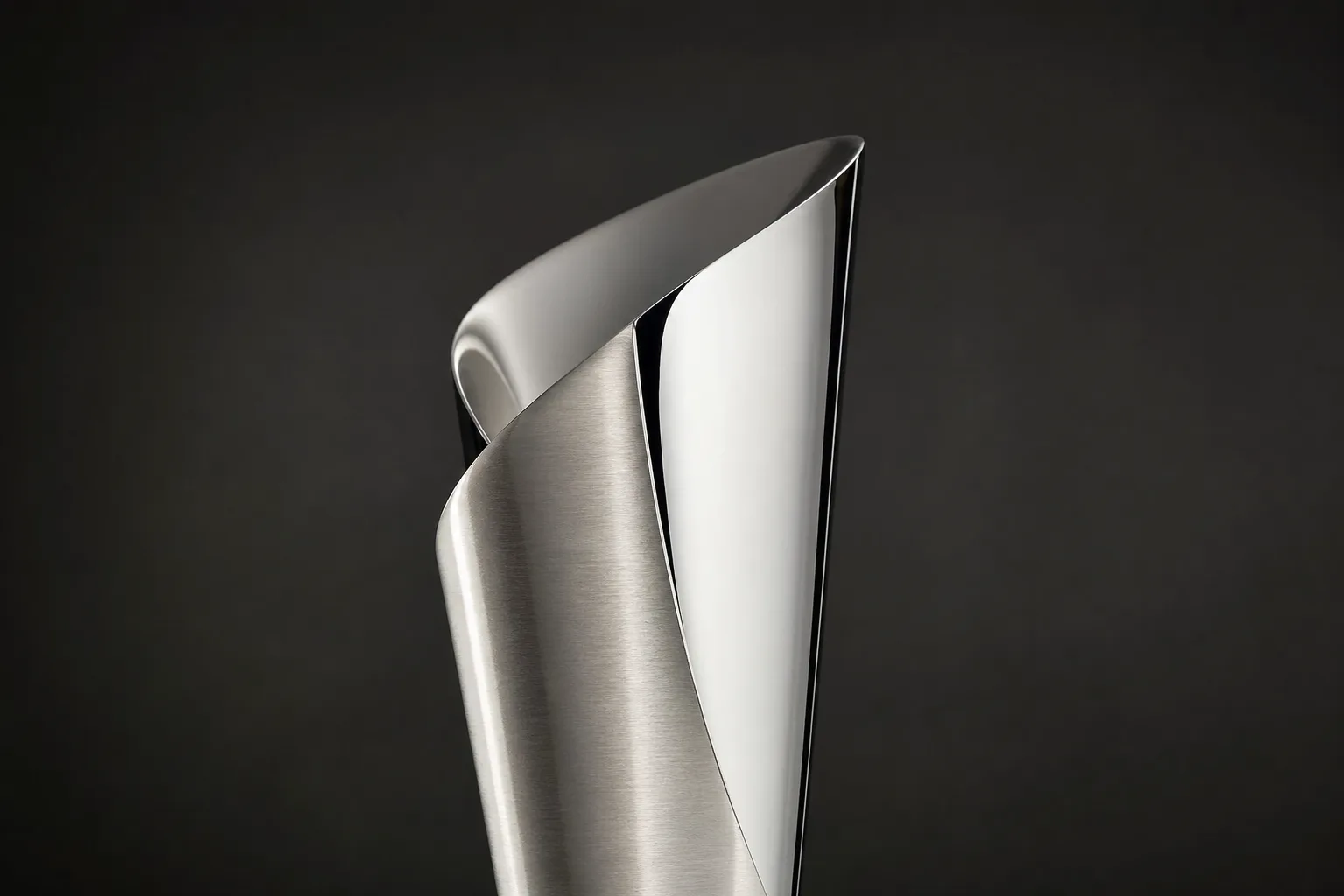 Close view of contrasting brushed and polished metal trophy surfaces