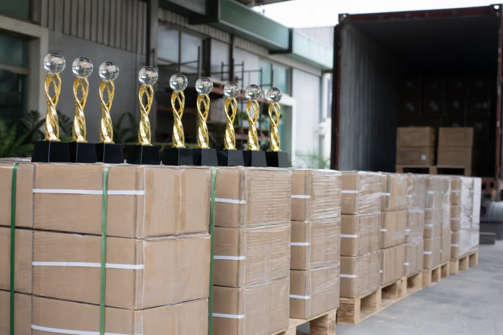 Custom trophies packed in protective cartons and palletized for export shipment